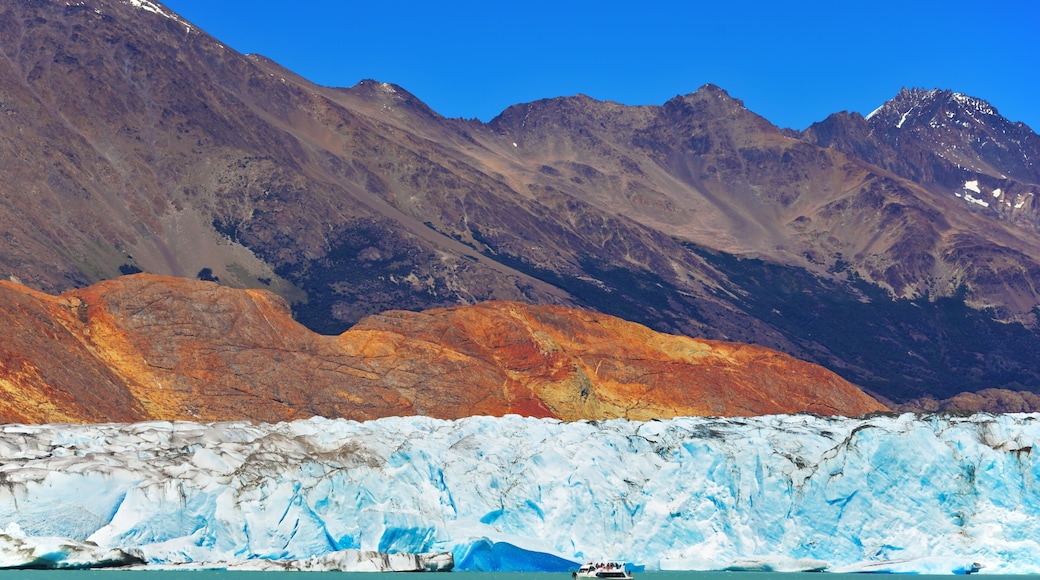 Excursion by boat to the huge white-blue glacier. Unique lake Viedma in Argentine Patagonia. The lake is surrounded by mountains