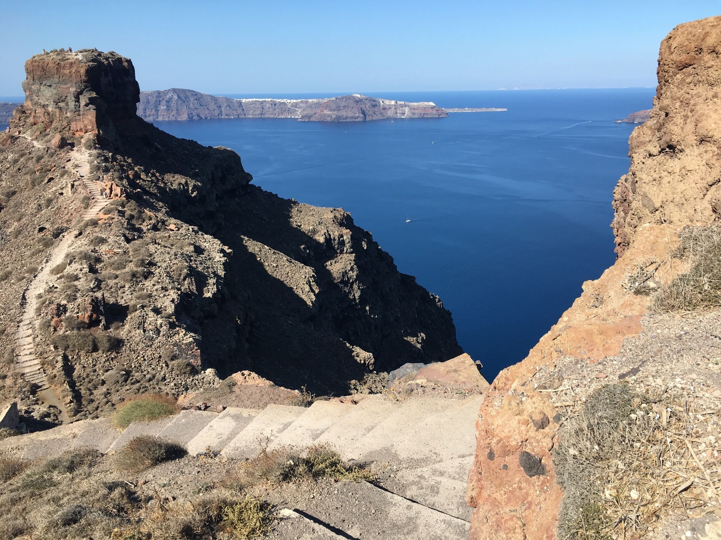 I was strolling on my early morning walk to Imerovigli , when I saw that there was a path towards Skaros Rock, which used to be a fortress. Skaros was one of the five fortified settlements and the most important one. The rock was inhabited in medieval times, because the fortress constructed there offered protection from pirates. At the top of the rock hung a large bell, to warn inhabitants of imminent pirate raids. Skaros was the capital of Santorini until the 18th century, although evacuation of Skaros started at the beginning of the 17th century. The rich Roman Catholics who had once lived there had moved to the town of Fira, abandoning the castle for a lower flatter level with access to the sea.
#BVSBlue

#instone
