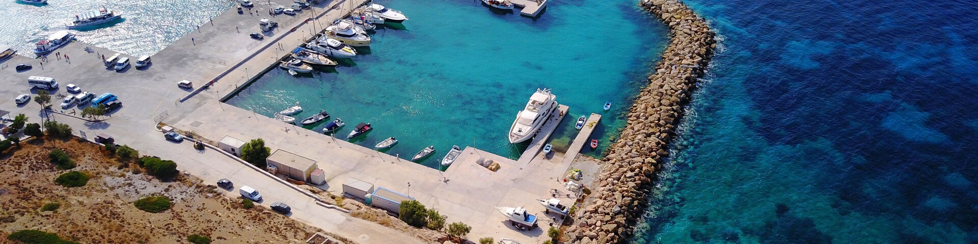 Aerial drone photo of iconic port of Koufonissi with docked boats and turquoise waters, Koufonissi island, small Cyclades, Aegean, Greece