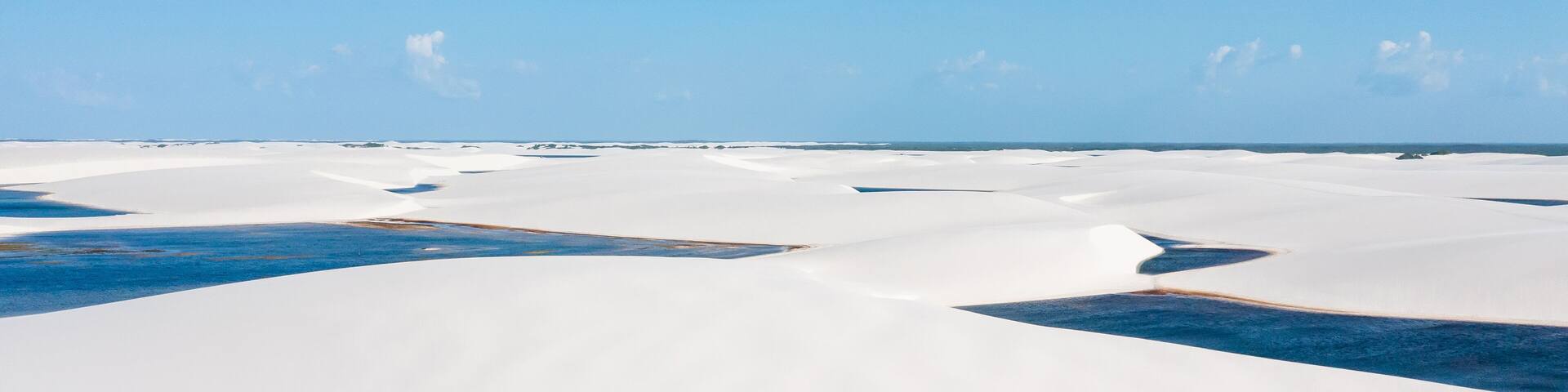 aerial view of the white sand dunes of Lencois Maranhenses with rain water pools