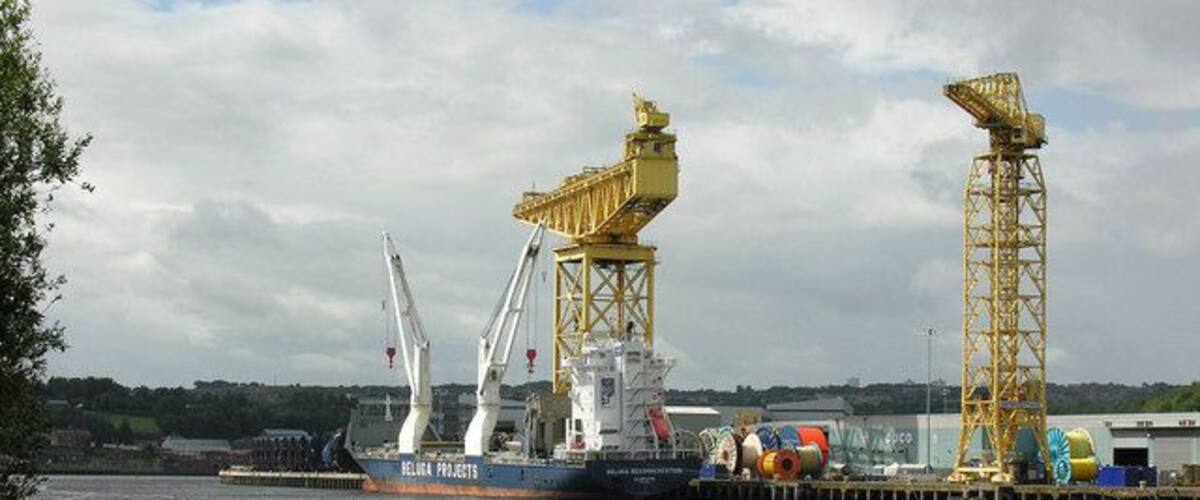The Tyne at Walker View across the Tyne from the Hebburn side, with a vessel alongside the Offshore Technology Park wharf at Walker .... this was formerly the fitting-out quay for the Vickers shipyard. The big hammerhead crane is still in regular use for the handling of large reels of cable.