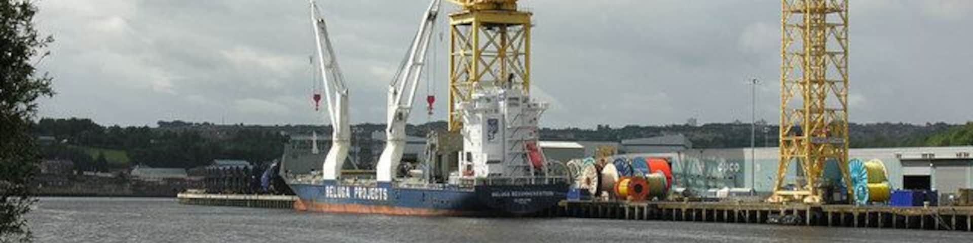 The Tyne at Walker View across the Tyne from the Hebburn side, with a vessel alongside the Offshore Technology Park wharf at Walker .... this was formerly the fitting-out quay for the Vickers shipyard. The big hammerhead crane is still in regular use for the handling of large reels of cable.