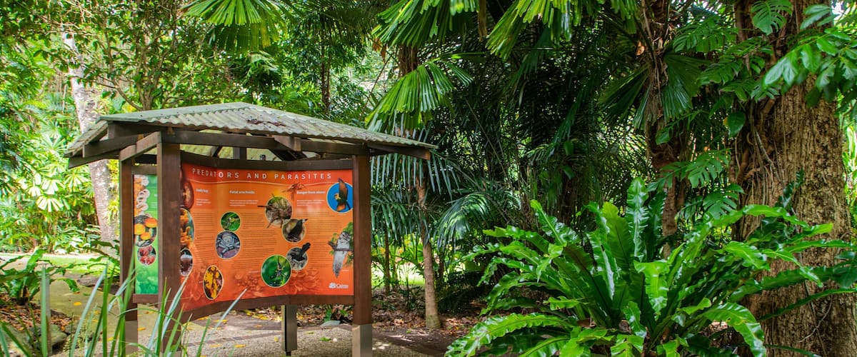Centenary Lakes Botanic Gardens featuring a garden and signage