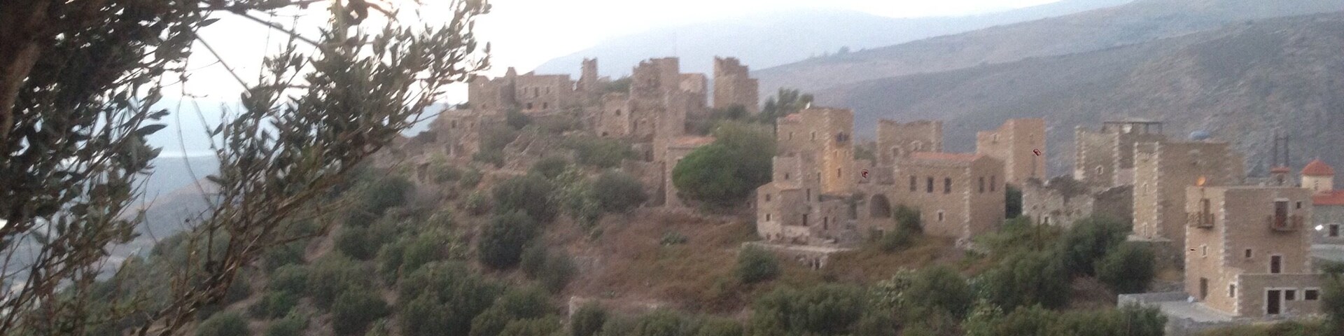 An abandoned village is being restored . Towers are being renovated and the journey back in time begins in mani , in Peloponnese, Greece
