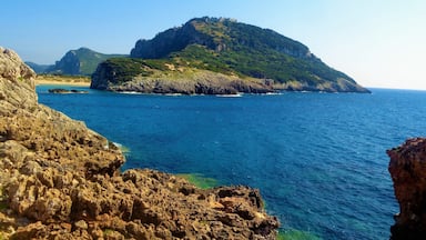 I took this photo in Messinia, Greece in summer 2016. It's of Voidokilia Beach and it's surroundings. Voidokilia Beach is on the Peloponnese peninsula and it was the most picturesque beach that I visited during that Greek trip, which was almost exclusively in Messinia. On that mountain is Nestor's Cave and above this are the ruins of a 13th-century Frankish castle (Old Navarino or Palaiokastro). Look closely and you will see :). I didn't get to walk up there. It was brutally hot that day and I spent most of the time at the beach. But, I did make time for some hiking. Near where I took this photo there was a lot of medieval or ancient ruins. Near those beautiful rocks. I had to be careful when walking on them, but it was worth it!