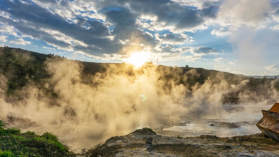 cenic views of thermal springs and mud bath in Sarayköy which contains bicarbonates and sulfates and power plant producing electricity from the geothermal steam, Denizli, Turkey
