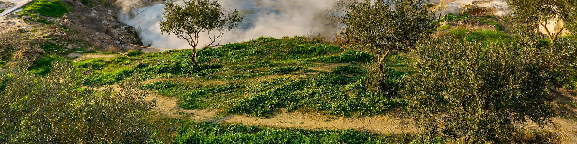 cenic views of thermal springs and mud bath in Sarayköy which contains bicarbonates and sulfates and power plant producing electricity from the geothermal steam, Denizli, Turkey