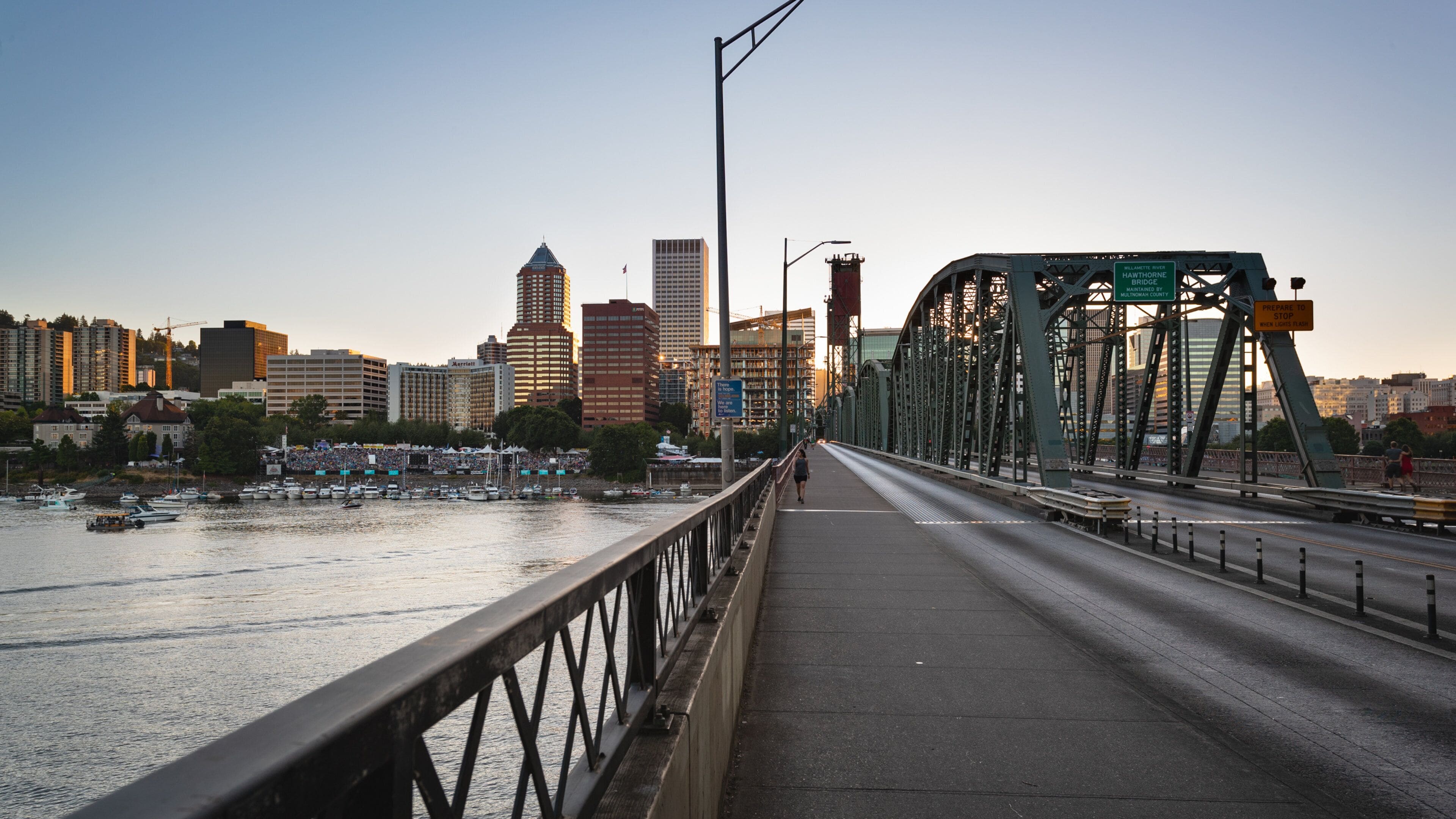 Hawthorne Bridge showing a city, a bridge and a sunset