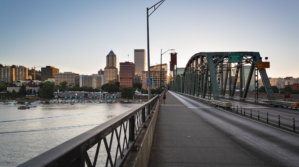 Hawthorne Bridge showing a city, a bridge and a sunset