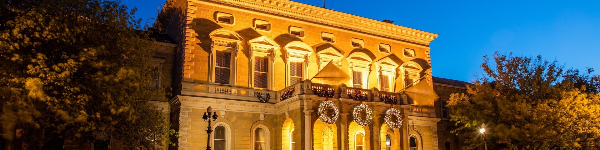 Hobart Town Hall featuring heritage architecture, night scenes and an administrative buidling