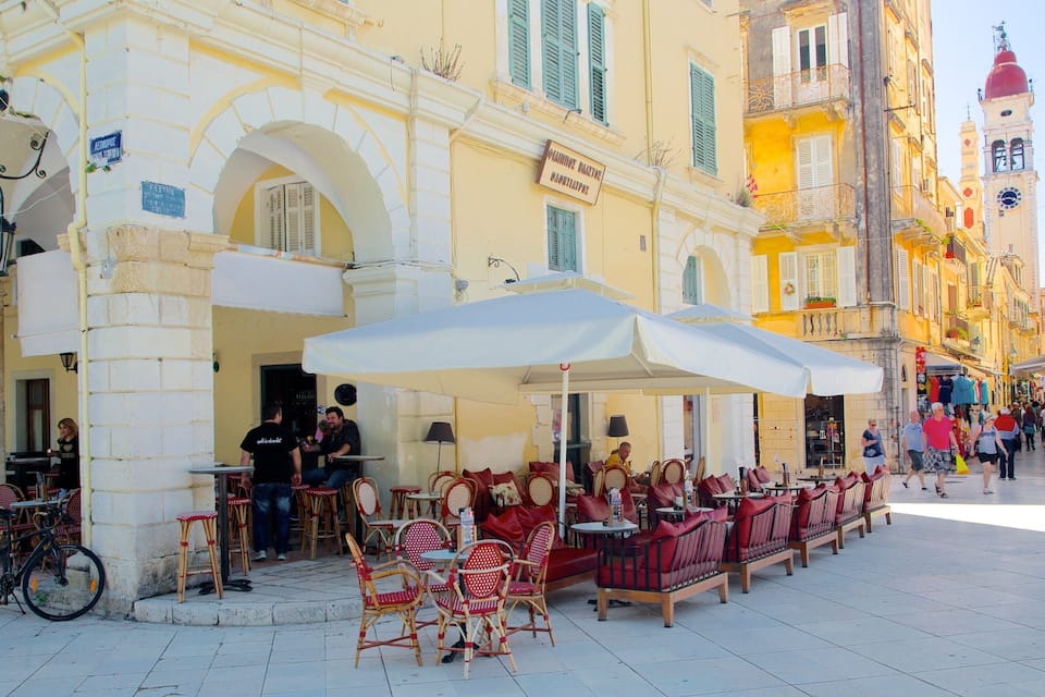 A café with outdoor seating and a bicycle parked nearby.