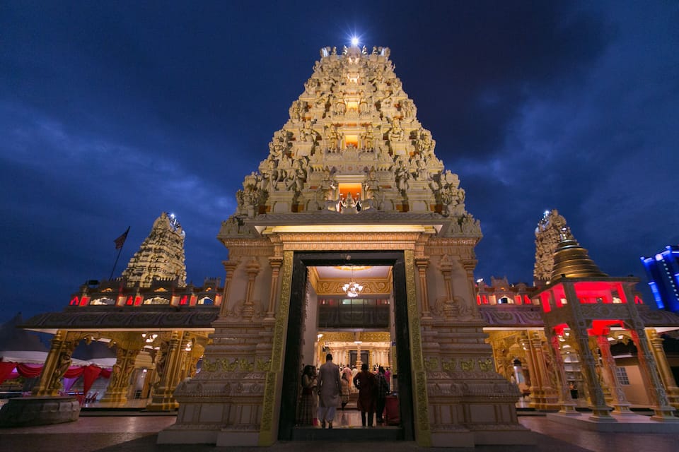 A temple with intricate carvings and a large entrance.