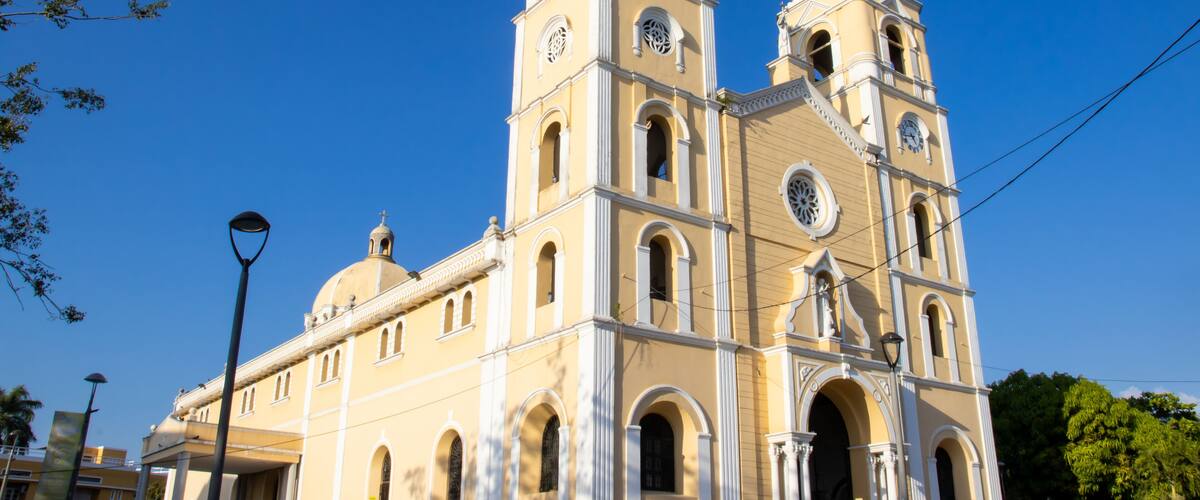 A large church with two bell towers and a dome.