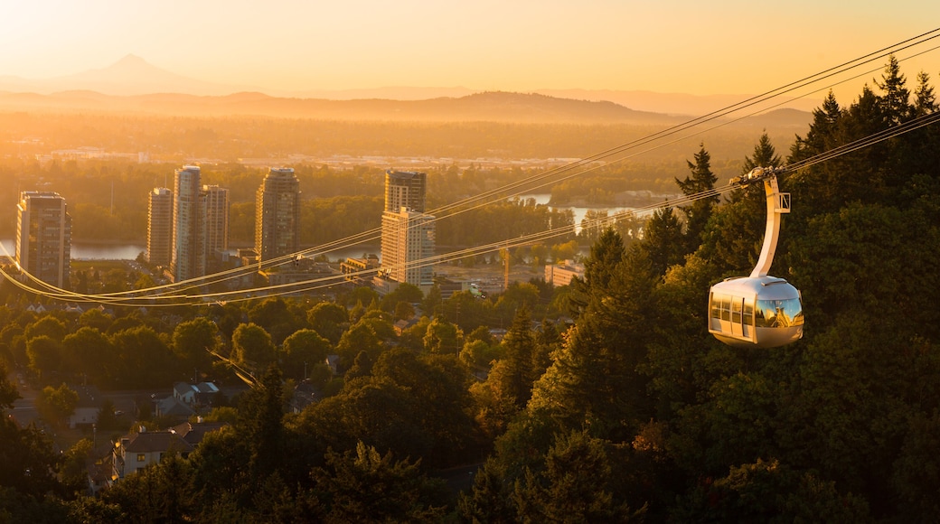 Cable car in Portland, Oregon, USA with wonderful view on sunrise with mt. Hood and aerial tram going to OHSU