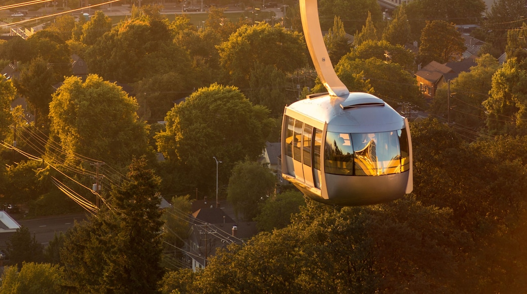Cable car in Portland, Oregon, USA with wonderful view on sunrise with mt. Hood and aerial tram going to OHSU