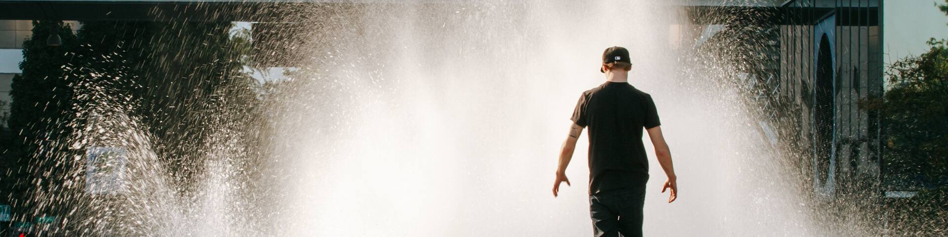 Salmon Street Springs which includes a fountain as well as an individual male