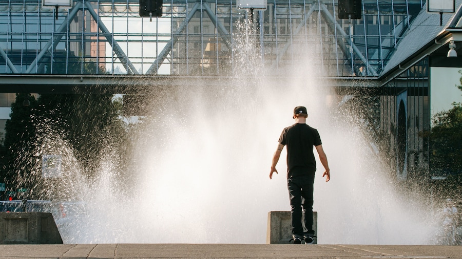 Salmon Street Springs which includes a fountain as well as an individual male