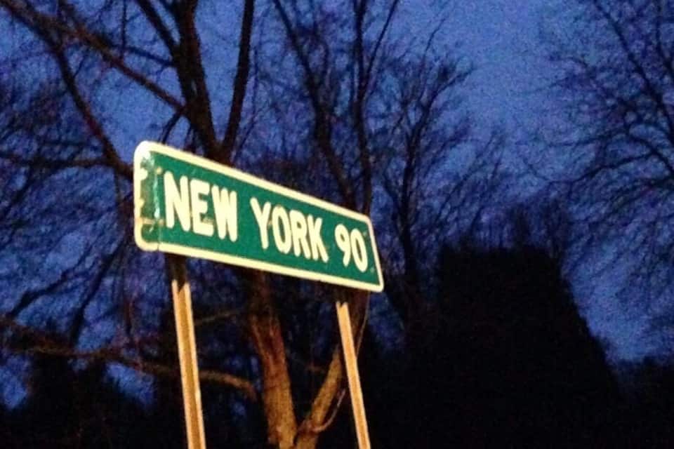 A street sign for New York 90.
