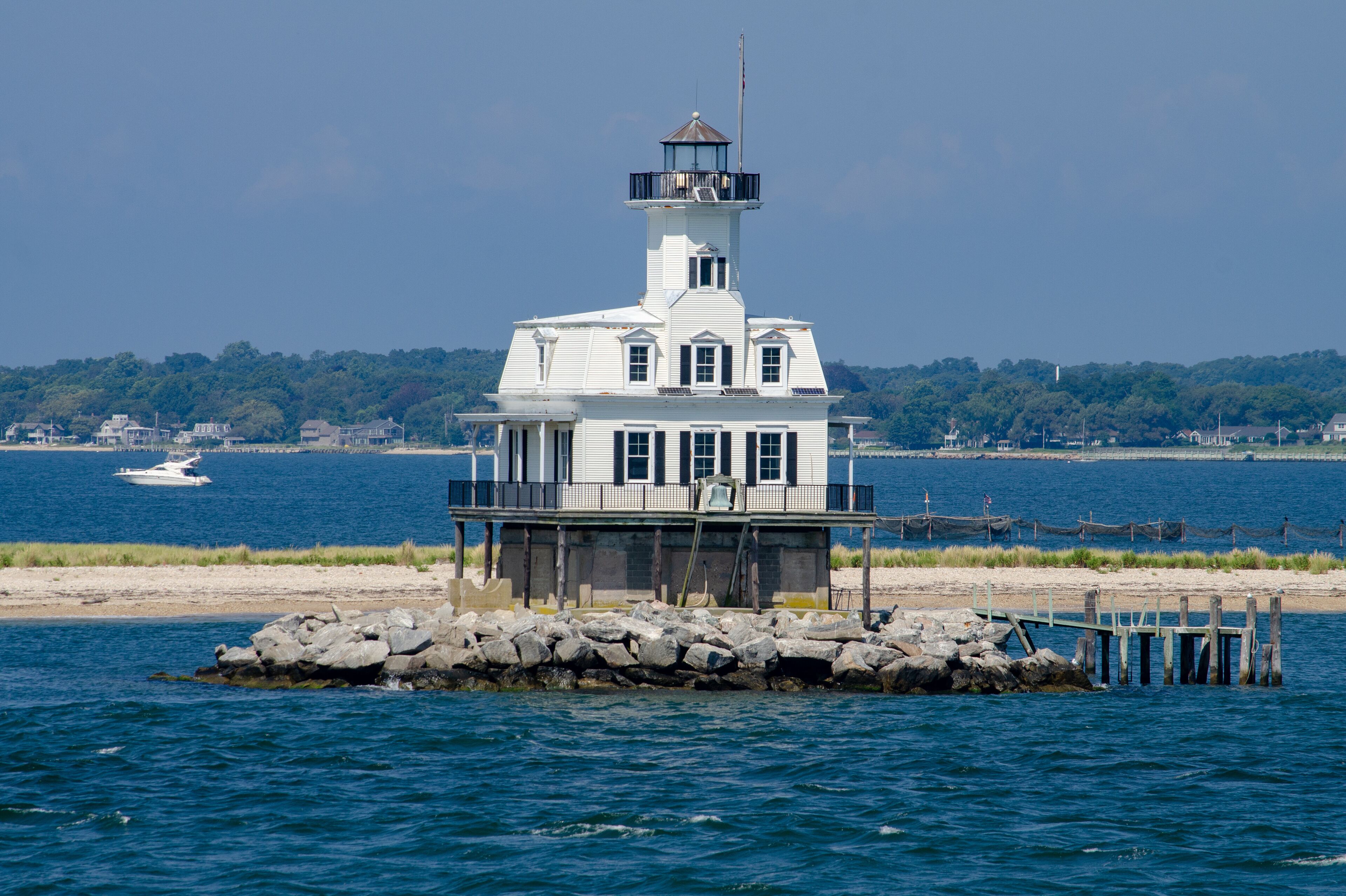 Long Beach Bar Light is a lighthouse off Orient, New York. It was originally a screwpile lighthouse that was later converted to concrete caisson foundation. 