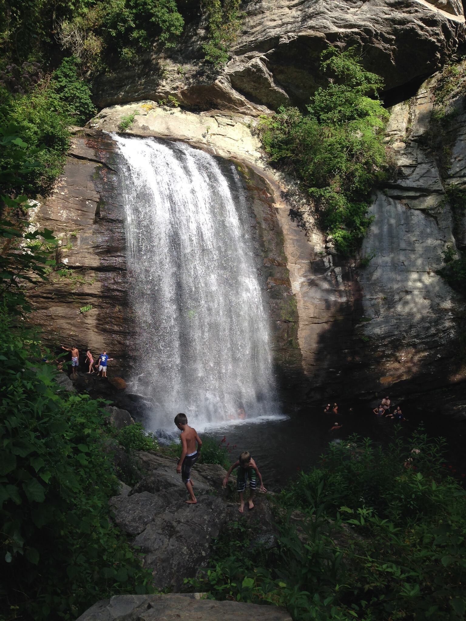 A cool summer plunge in the swimming hole beneath Looking Glass Falls in Brevard, NC.