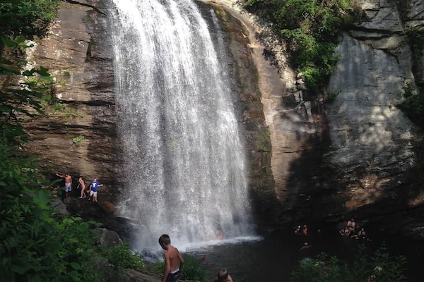 A cool summer plunge in the swimming hole beneath Looking Glass Falls in Brevard, NC.