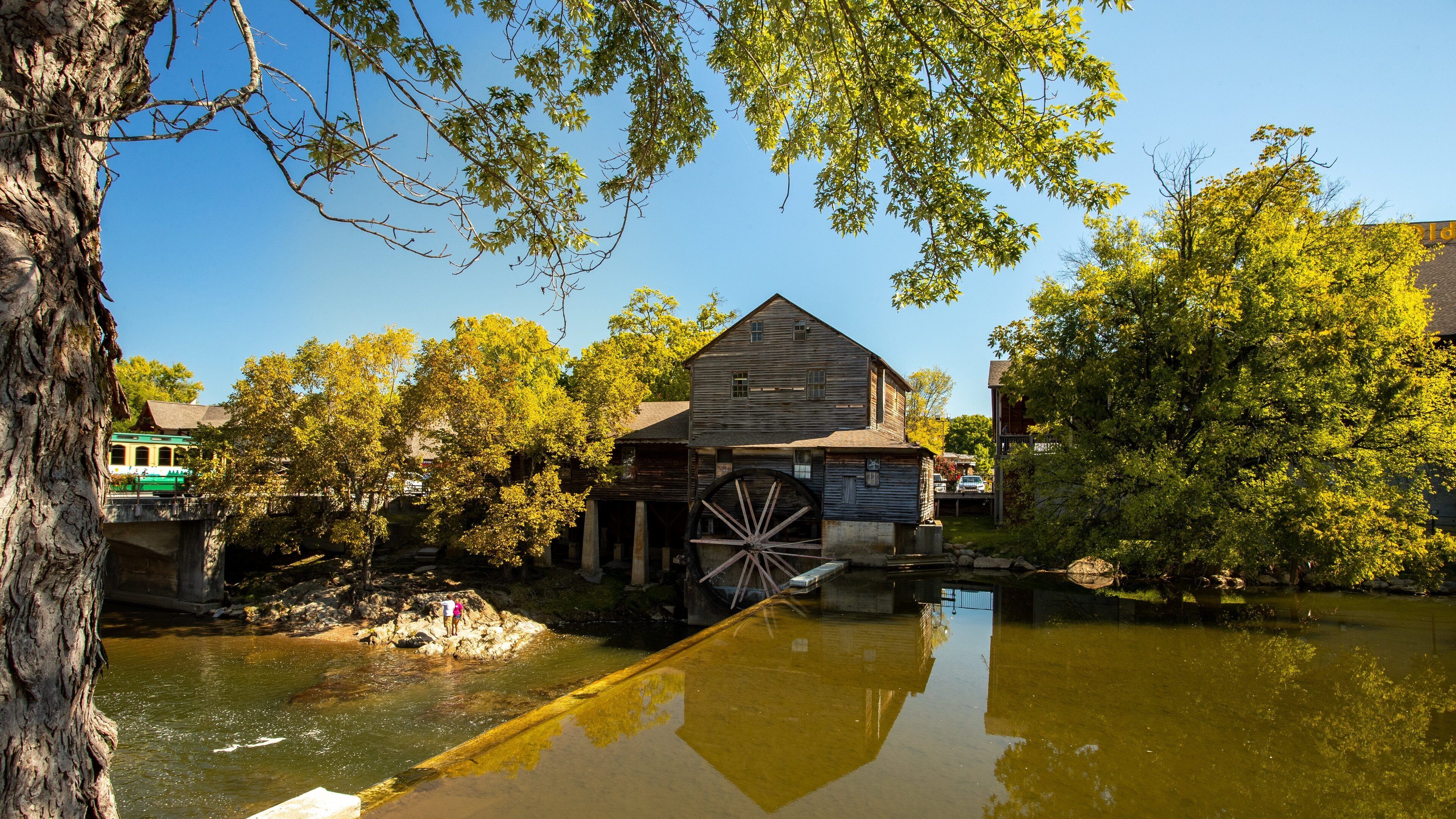 Old Mill which includes heritage elements and a river or creek