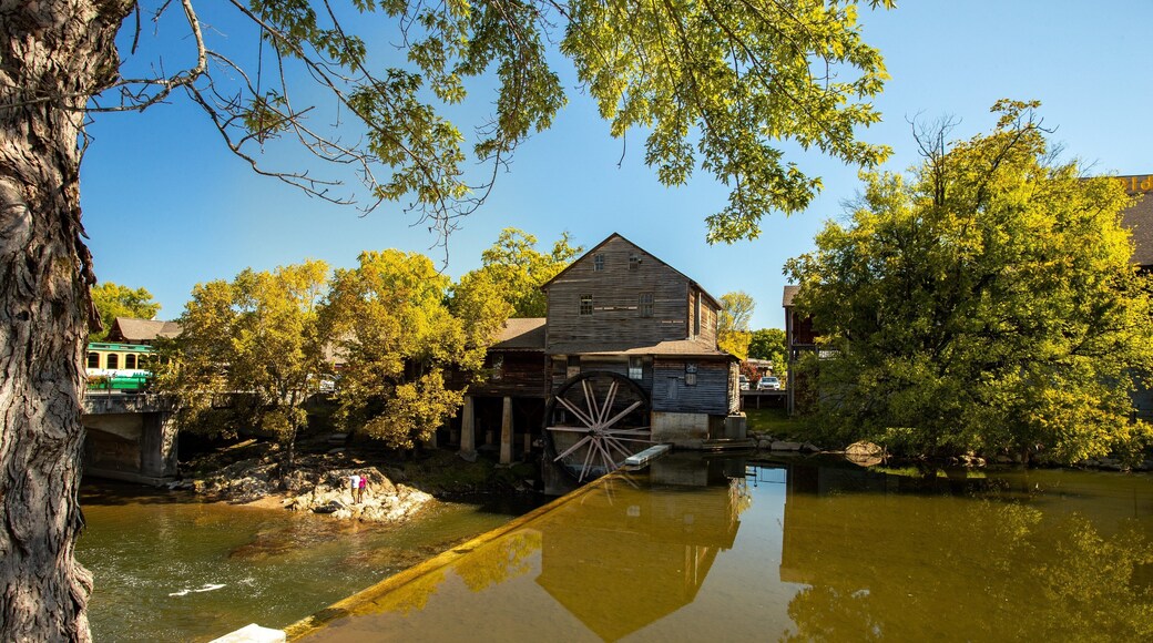 Old Mill which includes heritage elements and a river or creek