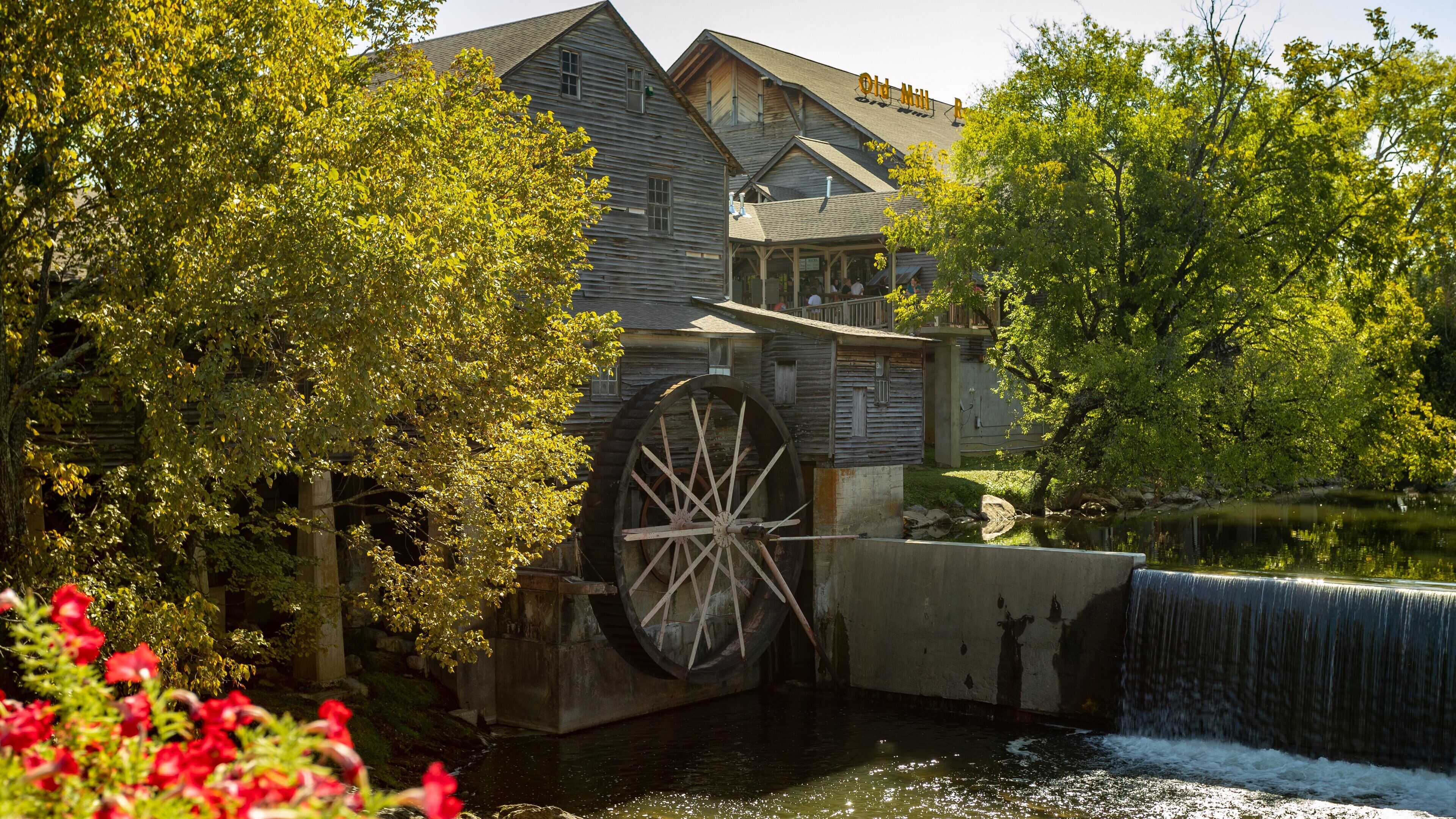 Old Mill which includes heritage elements and a river or creek