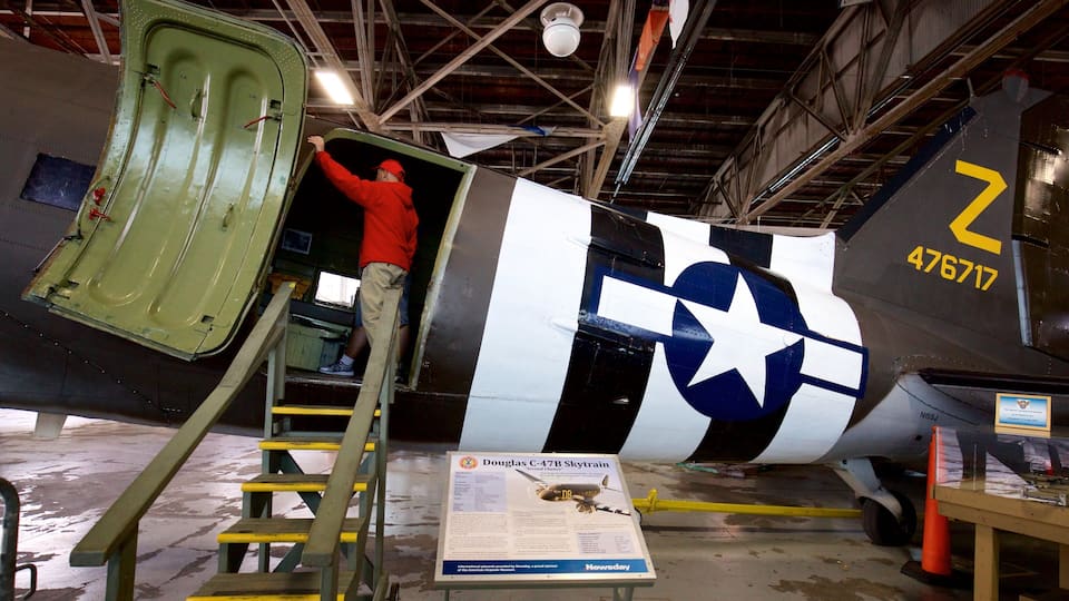 A Douglas C-47B Skytrain aircraft with a ladder leading to its open door, a large star insignia, and the number 476717 on its side.