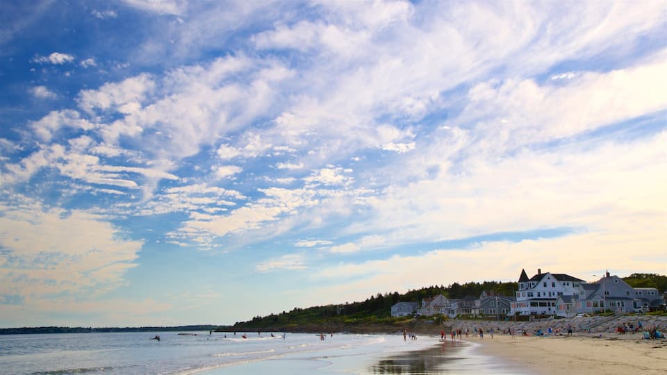 Higgins Beach showing a coastal town, a beach and a sunset