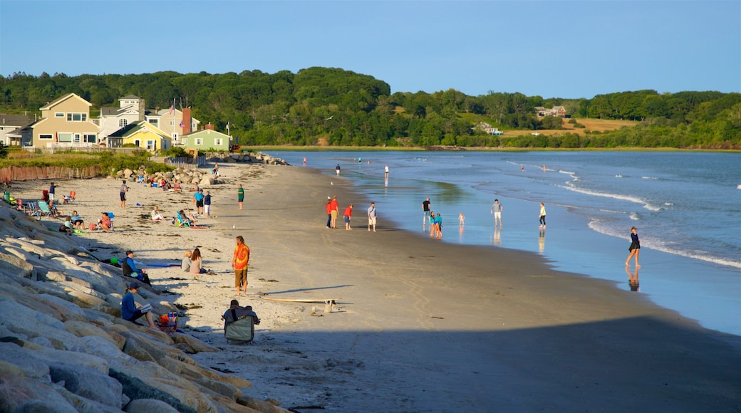 Higgins Beach showing general coastal views and a beach as well as a small group of people