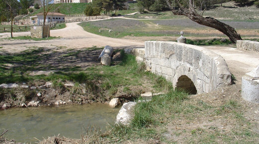 Riansares river, crossing rhe roman bridge with the Riánsares Virgin shrine in the background. Tarancón - Cuenca - Spain