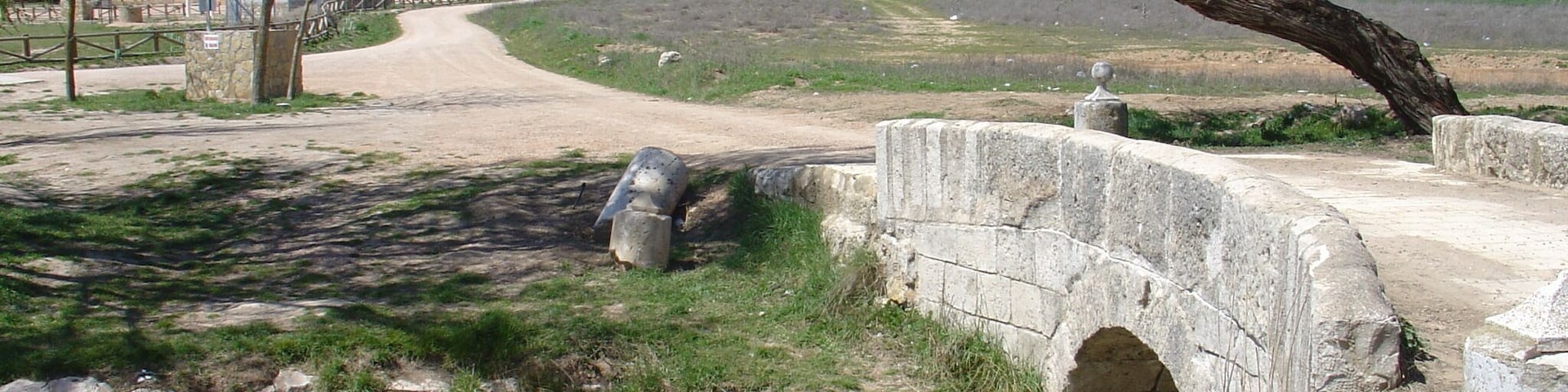 Riansares river, crossing rhe roman bridge with the Riánsares Virgin shrine in the background. Tarancón - Cuenca - Spain