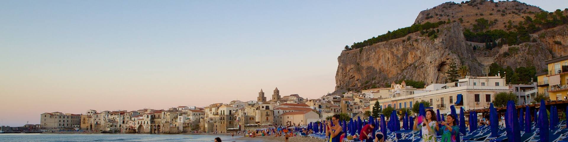 Rocca of Cefalu which includes a coastal town and a sandy beach
