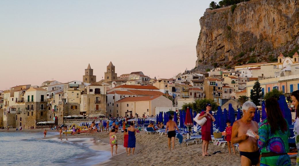 Rocca of Cefalu showing a coastal town, heritage architecture and a beach