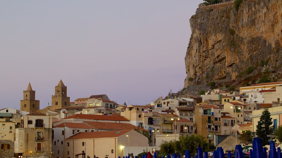 Rocca of Cefalu which includes a sunset and a small town or village