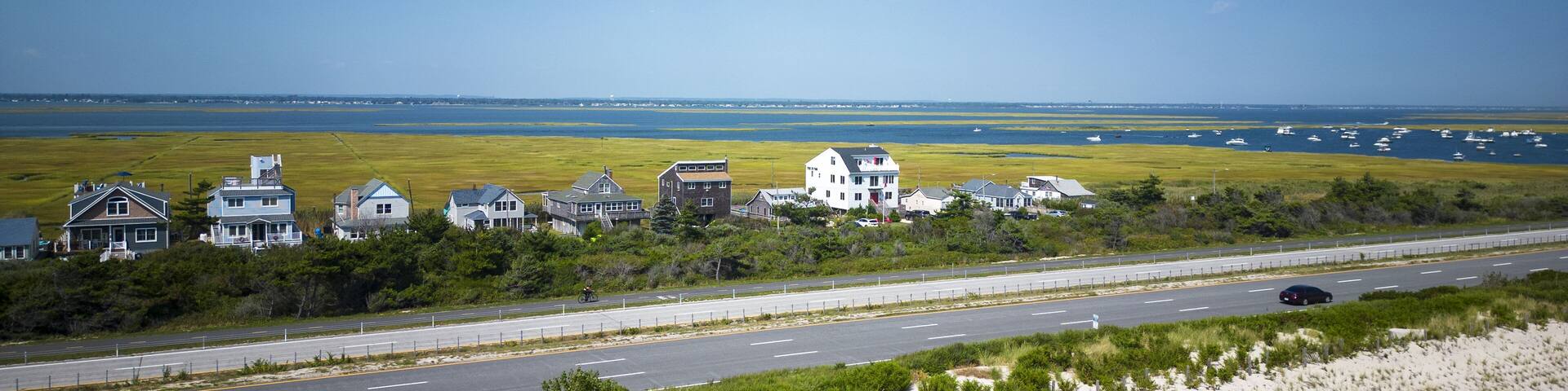 Drone view over the sand dunes of Giglgo Beach at houses and the great south bay