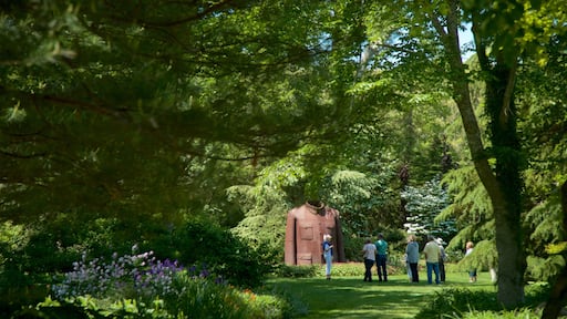 LongHouse Reserve featuring a park and outdoor art as well as a small group of people