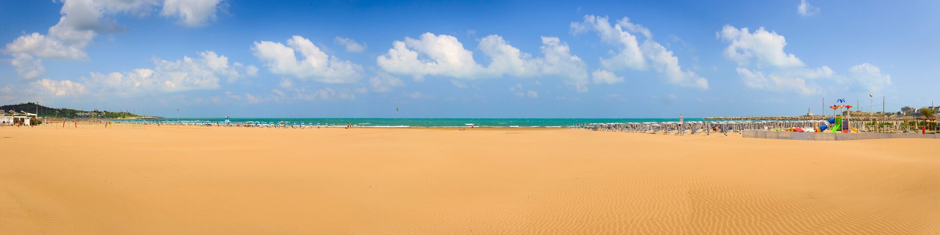Gargano coast: Bay of Vieste, (Apulia) Italy. Convento or San Lorenzo beach, which is so long that it has two names, is located nearby Vieste and is buzzing with private and public beaches.