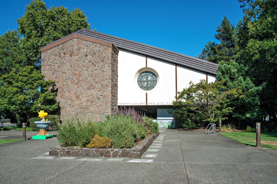 A building with a stone facade and a large circular window.