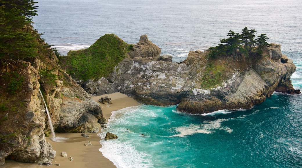 McWay Falls which includes general coastal views, a sandy beach and rugged coastline