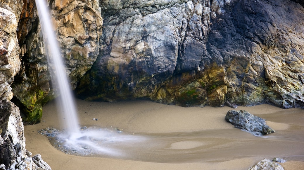 McWay Falls featuring a sandy beach and a waterfall