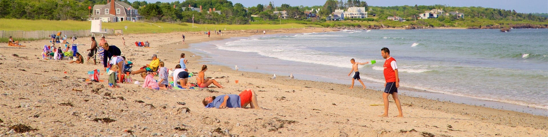 Scarborough Beach State Park featuring general coastal views and a sandy beach as well as a small group of people