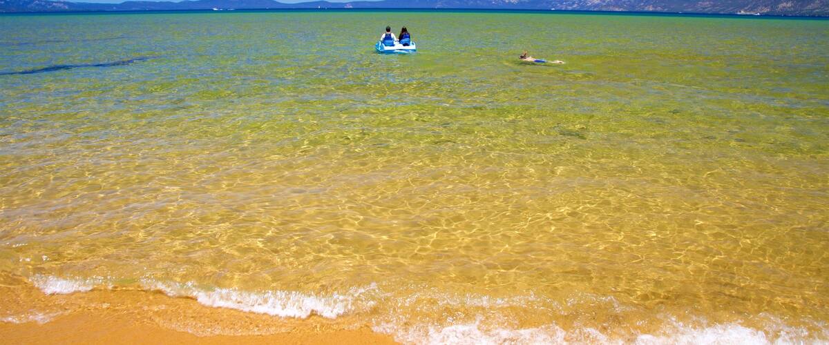 Pope Beach showing a lake or waterhole, kayaking or canoeing and a beach