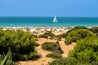 pleasure boats passing in front of La Barrosa beach in Sancti Petri Cadiz