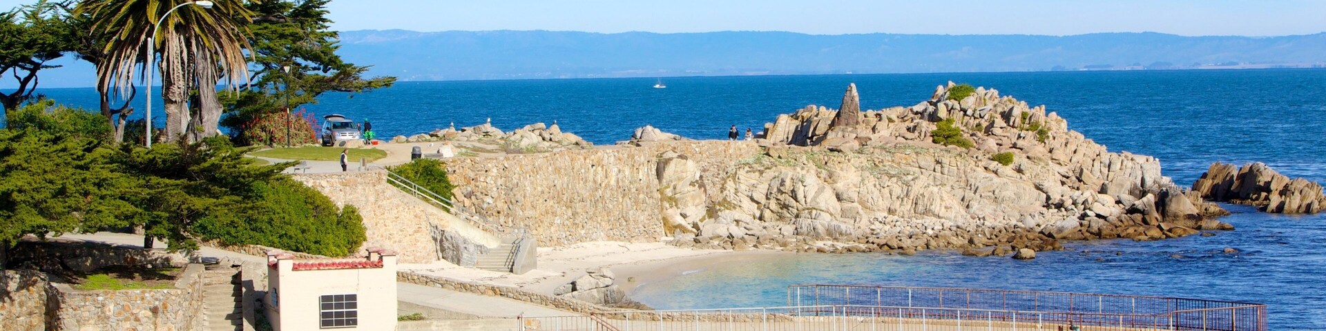 Lovers Point which includes rugged coastline and general coastal views