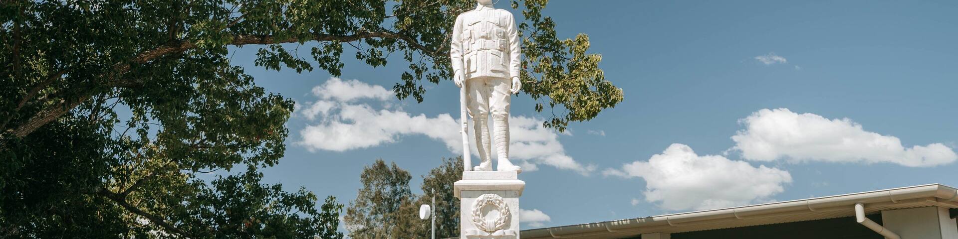 Nanango showing a statue or sculpture and signage