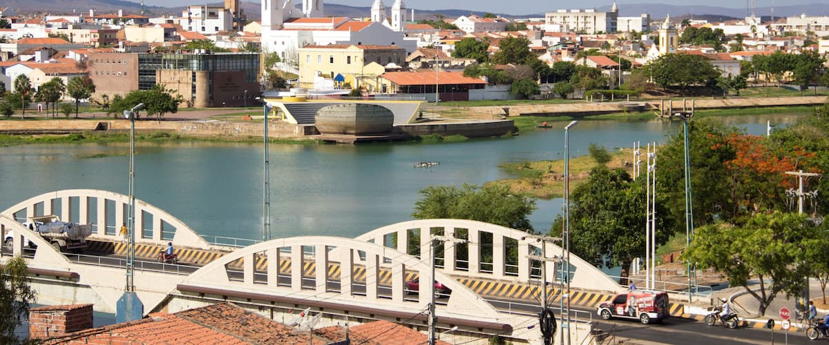 A cityscape with a river, bridges, and historic buildings.