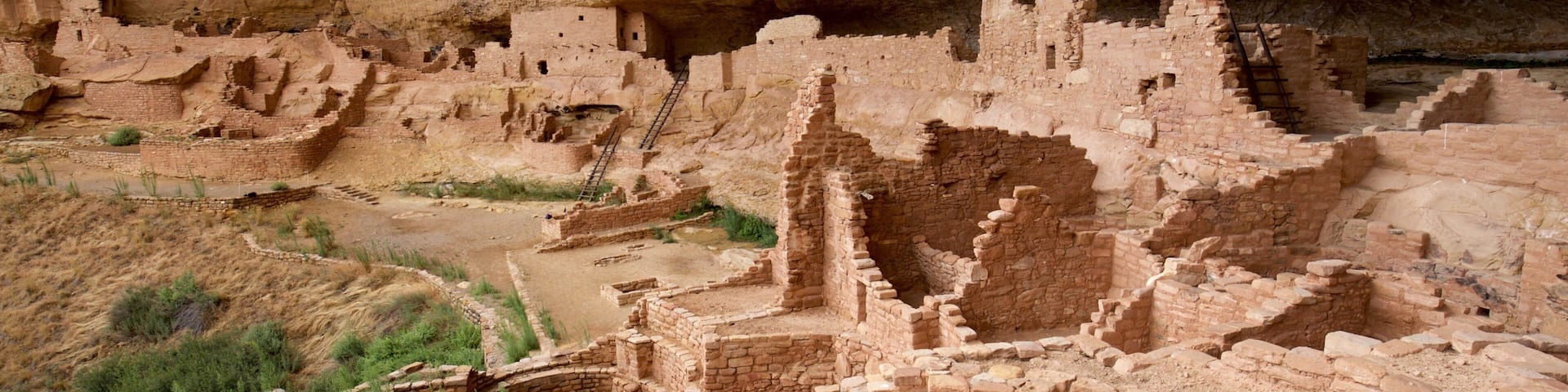 Long House which includes building ruins and heritage architecture