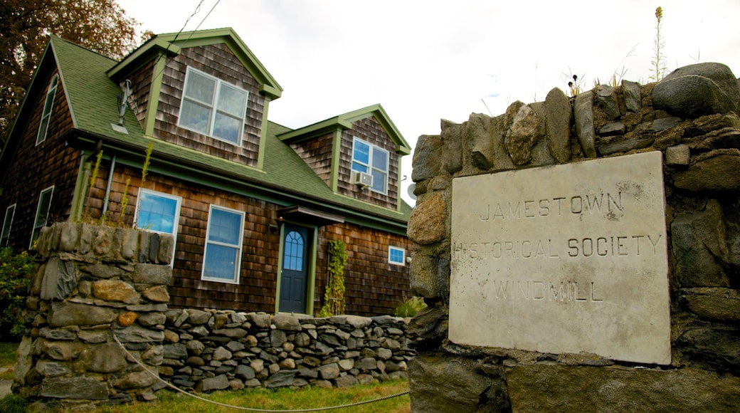 Jamestown Windmill featuring signage, a house and heritage elements